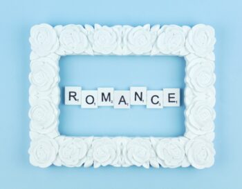 Romance scrabble letters word on a blue background