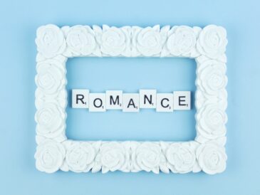 Romance scrabble letters word on a blue background